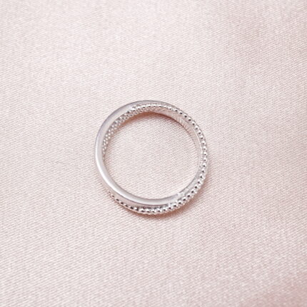 S925 textured band ring displayed on soft pink background