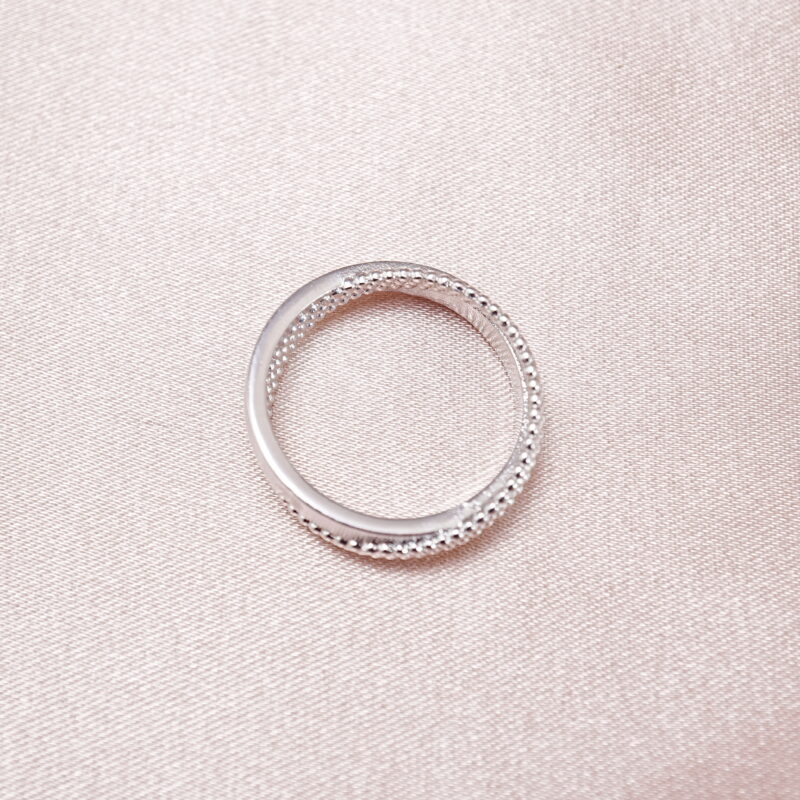 S925 textured band ring displayed on soft pink background