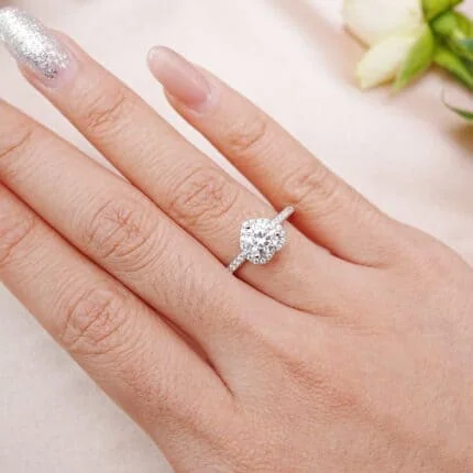 Heart-shaped moissanite halo ring in S925 silver worn on hand