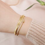 Model wearing a light luxury multi-strand metal bracelet on the wrist