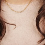 model wearing gold tone toggle necklace with leaf pendant