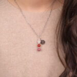 Cancer zodiac necklace with clear quartz, red agate, and rhodochrosite gemstones.