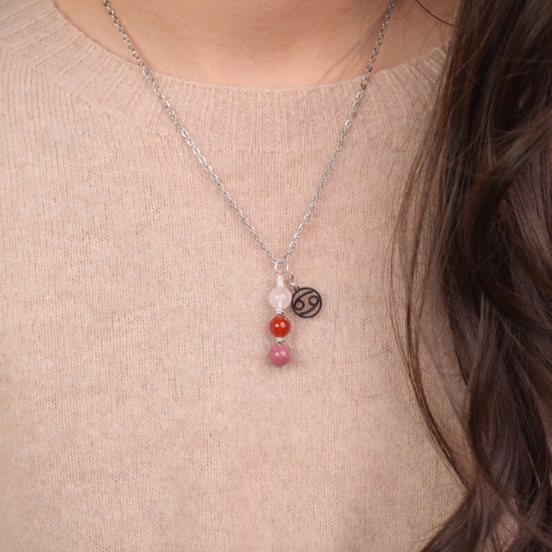 Cancer zodiac necklace with clear quartz, red agate, and rhodochrosite gemstones.