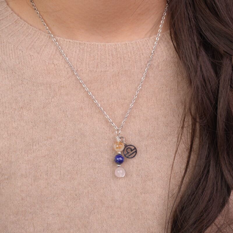 Model wearing Libra zodiac necklace with citrine, lapis lazuli, and clear quartz.