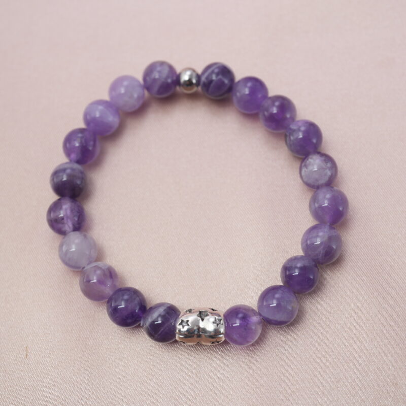 Amethyst bracelet with silver accent bead symbolizing peace, clarity, and protection.