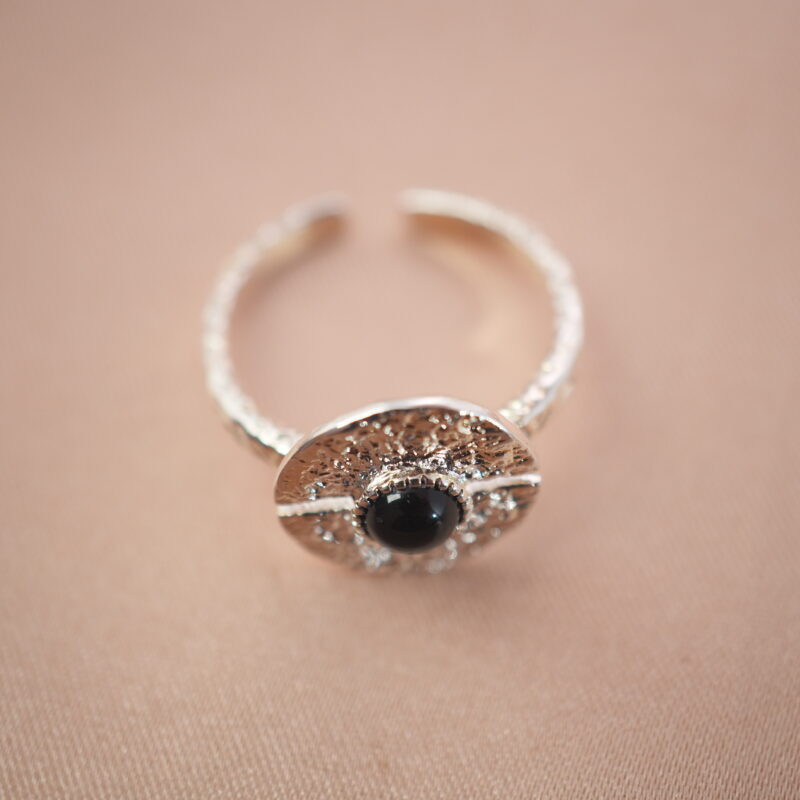 Silver evil eye adjustable ring featuring an obsidian center stone for grounding and protection.