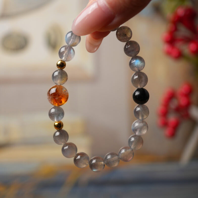 Handmade moonstone and citrine beaded bracelet featuring soft gray moonstone and golden citrine accents, symbolizing calm, emotional balance, and abundance