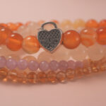 Macro detail of citrine and carnelian beads showing natural texture and luminous vitality energy.