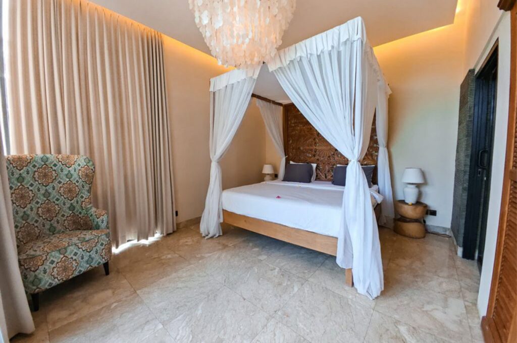 Custom teak bedroom furniture by Naramulya inside the oceanfront Ketewel Beach Villas in Bali.