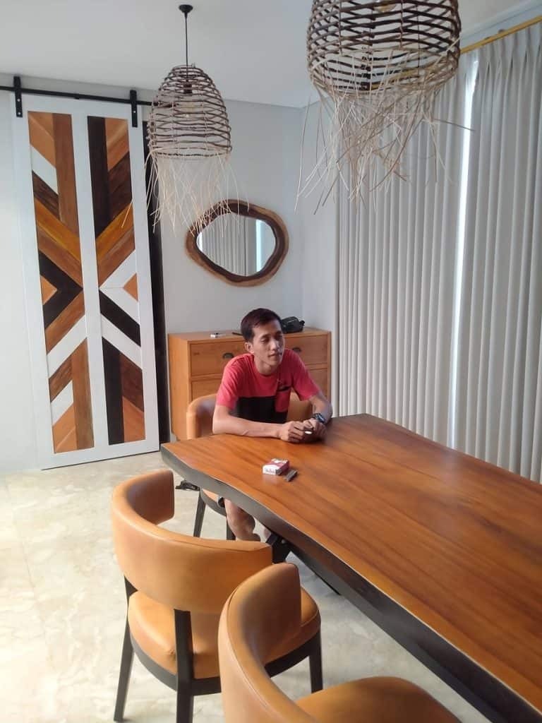 A collection of custom indoor teak furniture, including wardrobes, kitchen sets, and desks, manufactured by Naramulya for the Ketewel project.