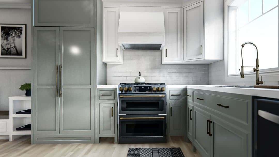 Modern white kitchen with stainless steel appliances and ample cabinet space.