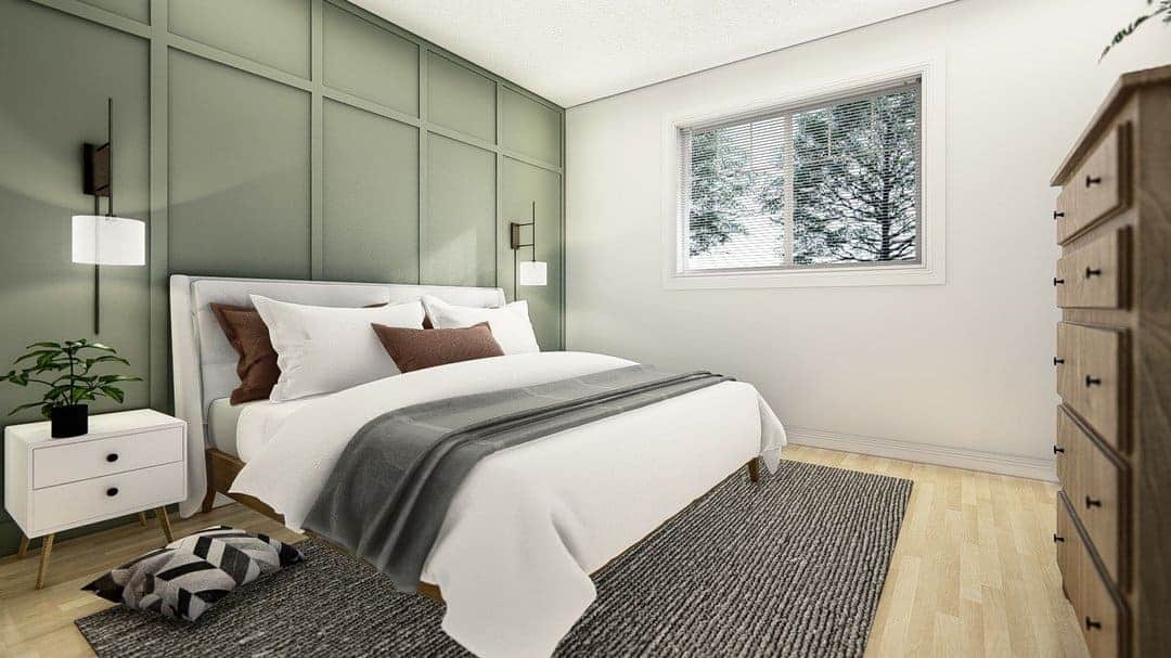 Modern bedroom with green accent wall and cozy bedding, perfect for home comfort.
