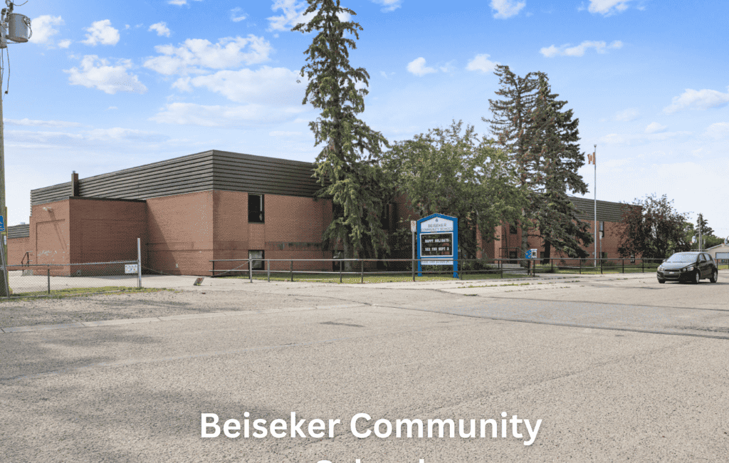 Modern Beiseker Community School building with a brick exterior and surrounding trees.