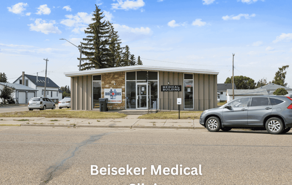 Beiseker Medical Clinic building with signage and parking lot in front, accessible healthcare services in a community setting.
