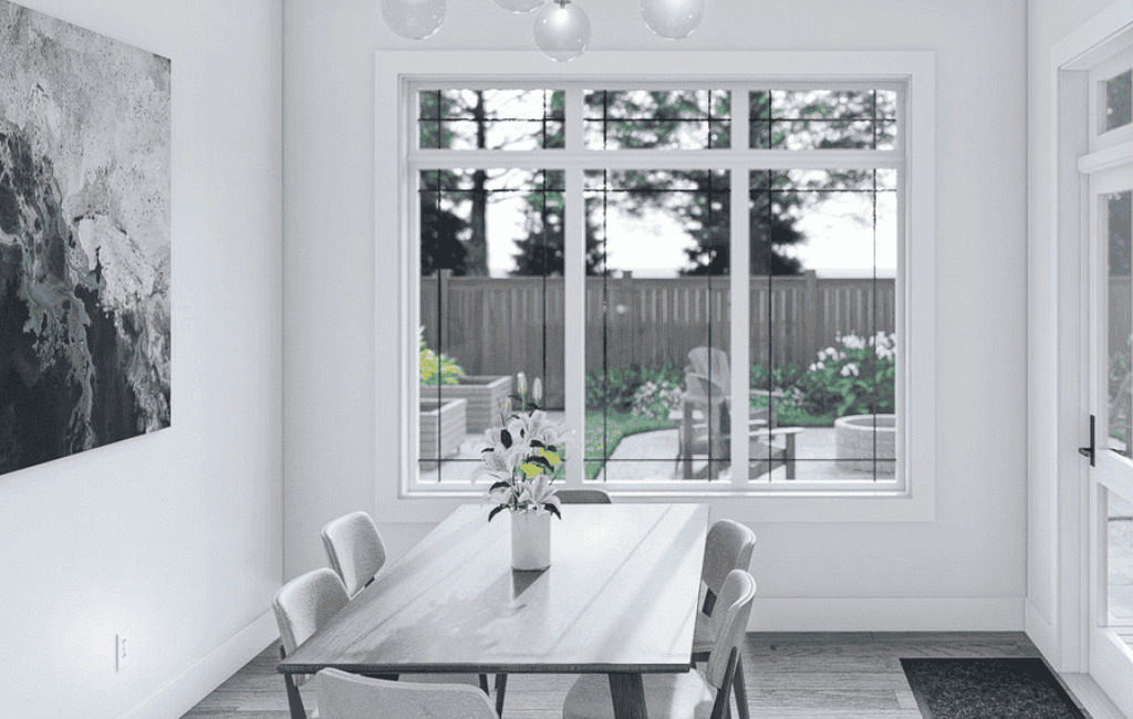 Modern dining room with large window and contemporary decor, perfect for family meals and entertaining.
