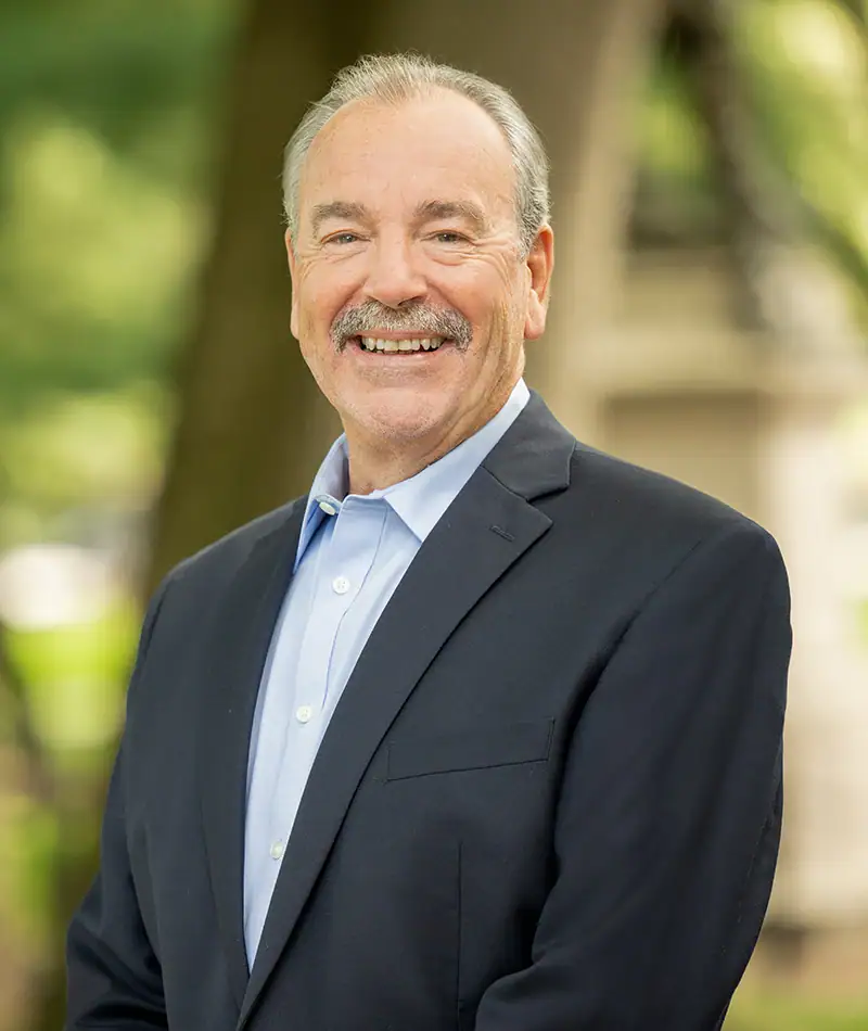 Headshot of Bruce M. Herman, New England Development