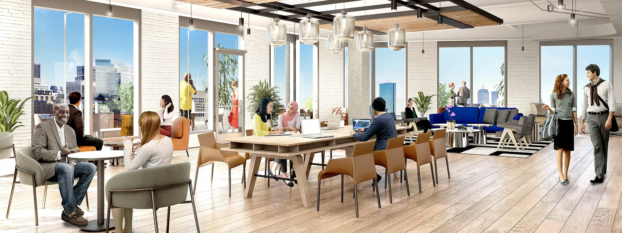 Modern office space with large windows, people working and socializing, wooden floors.