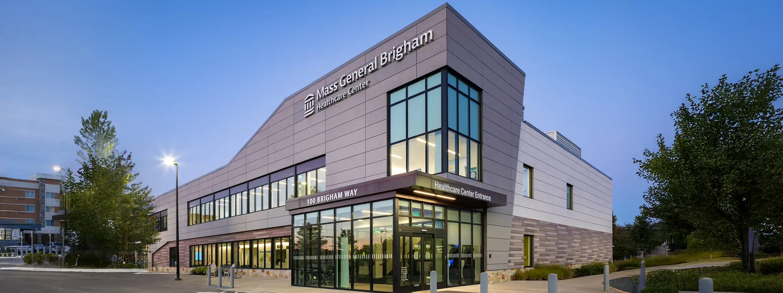 Mass General Brigham building with modern architecture and glass windows.