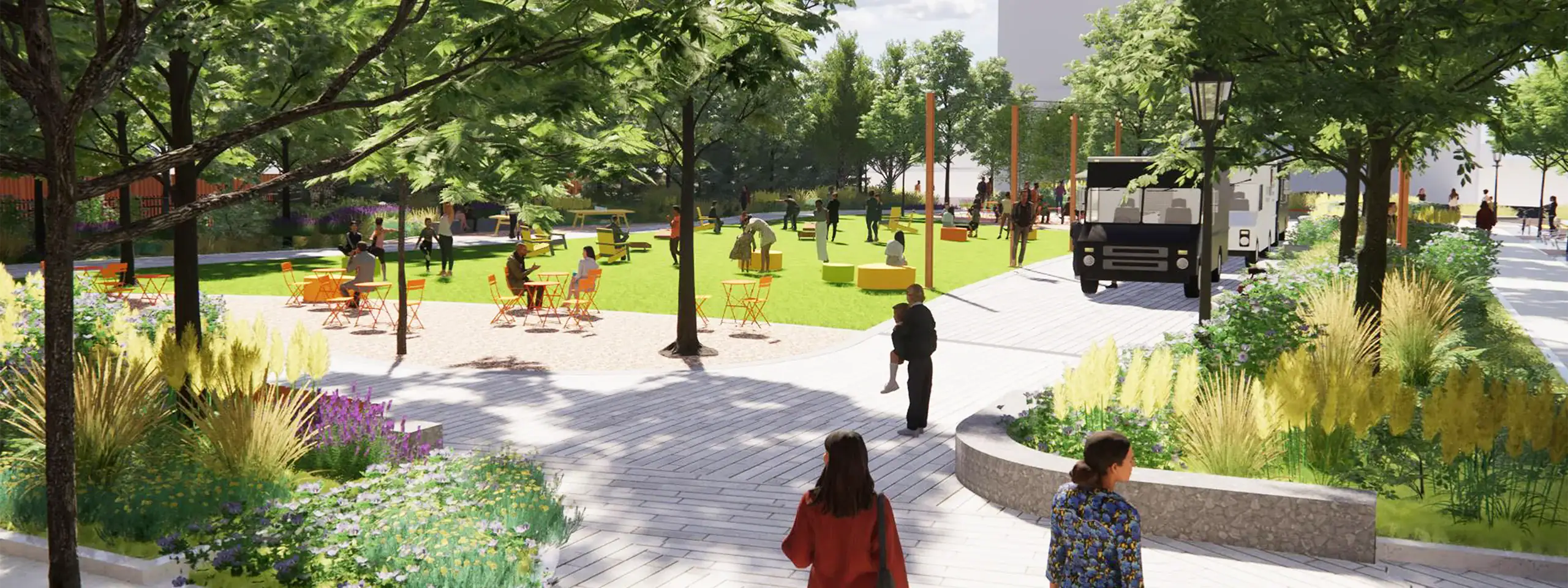 Urban park with trees, benches, walking paths, and people enjoying outdoor activities.