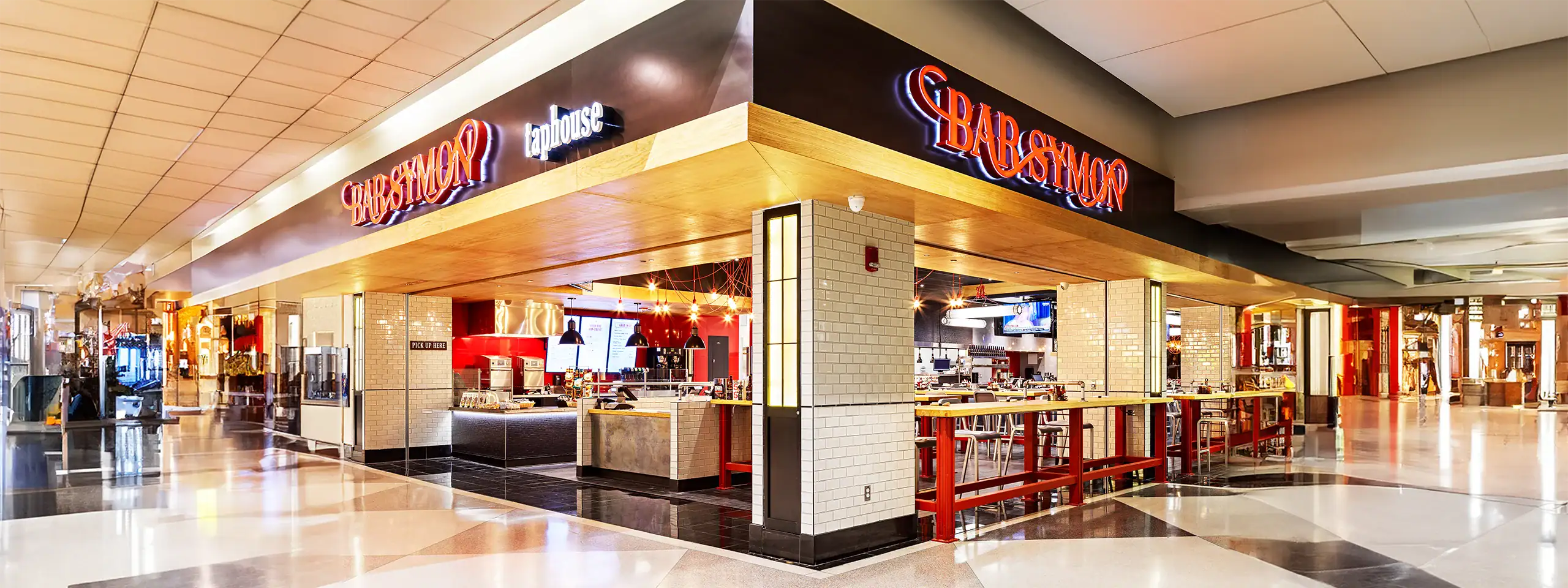 Shaboom restaurant with red and black signage inside a shopping mall.