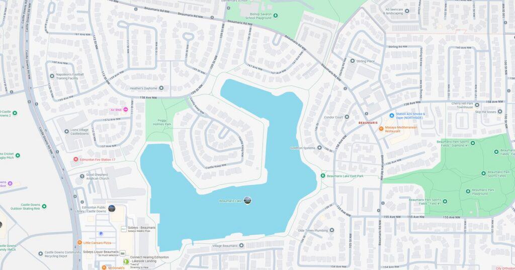 Detailed map of a residential area featuring a central lake, surrounding parks, and street layouts for navigation and urban planning.