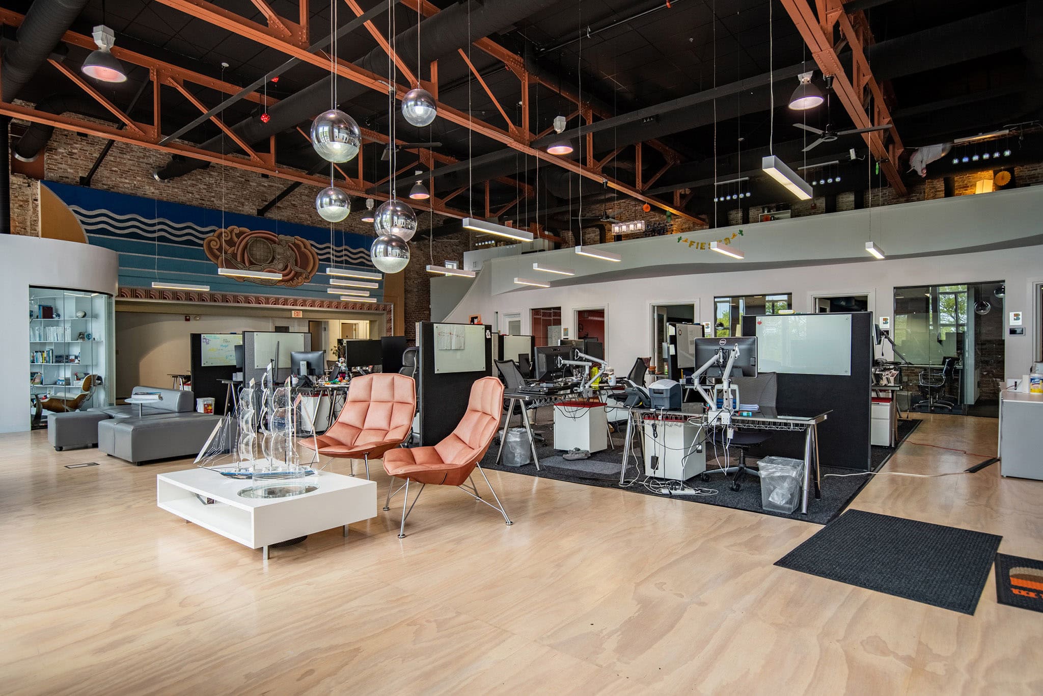 Modern coworking space with lounge area and workstations in Newburyport.
