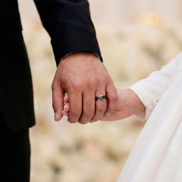 Mens black and rose gold ring – mans tungsten wedding band with custom engraving.