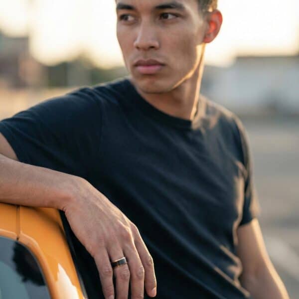 Mens black and rose gold ring – tungsten wedding band with personalised custom engraving.