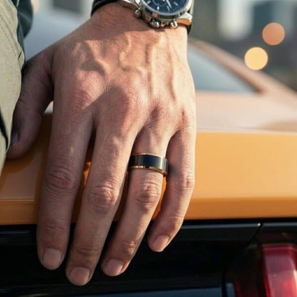 Mens black ring with rose gold edges – male wedding band with custom ring engraving.