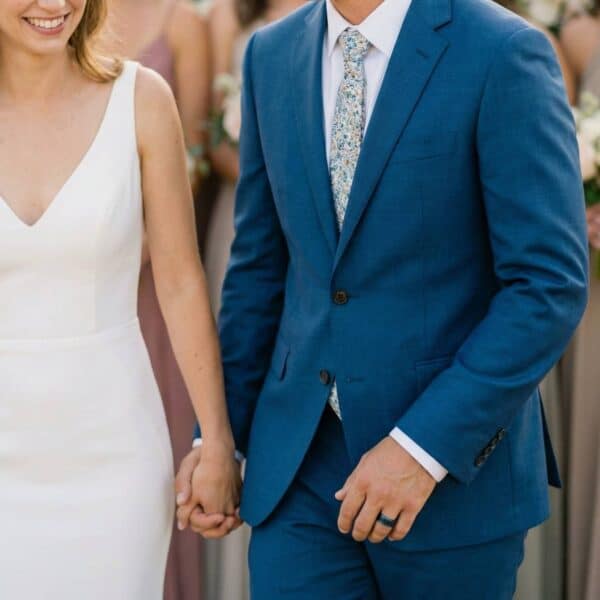 During the wedding ceremony, the man holds hands with the bride wearing his blue and black tungsten ring with a centre groove made with carbon fibre.