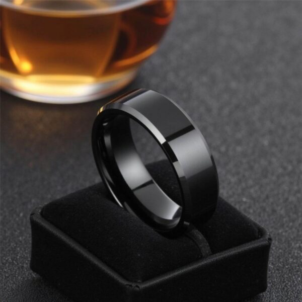 Mans black tungsten wedding band or fashion statement ring. Characterised by silver bevelled edges.