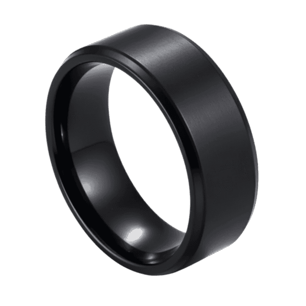 A zoomed in image showing a ring in close up detail. The ring is made with titanium and is all black. It has a slightly raised brushed centre and stepped polished edges.