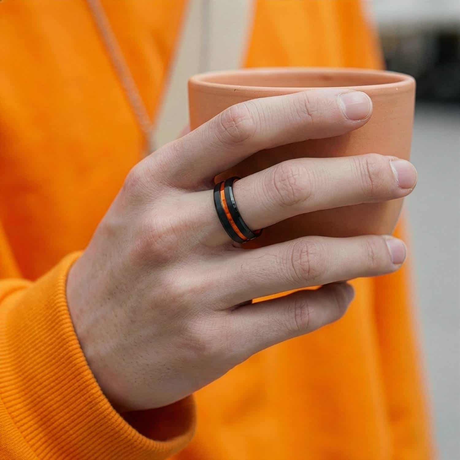 Black and orange ring for men – male wedding band with custom ring engraving.