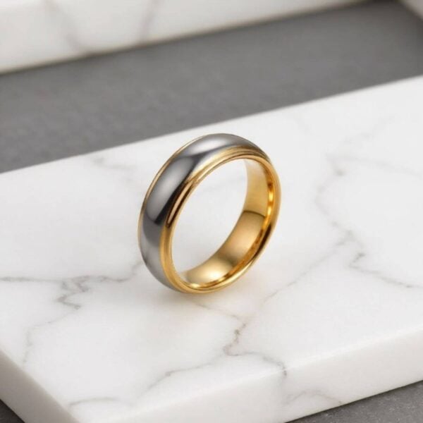 A silver and gold tungsten ring, perfectly suited as a mans wedding band or engagement ring. Or as a male fashion statement ring.