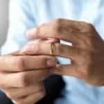 Man tries on his wedding ring