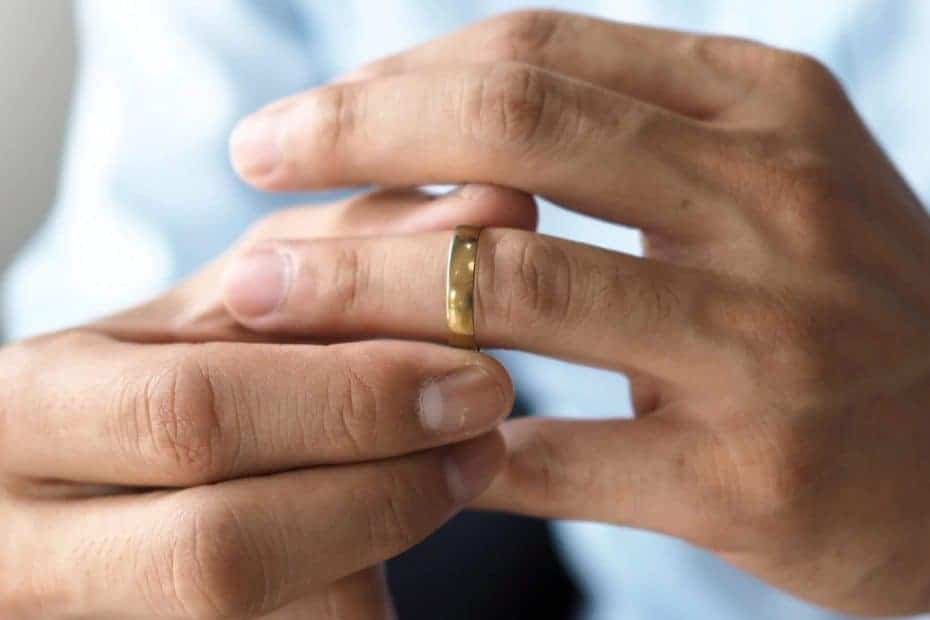 Man tries on his wedding ring