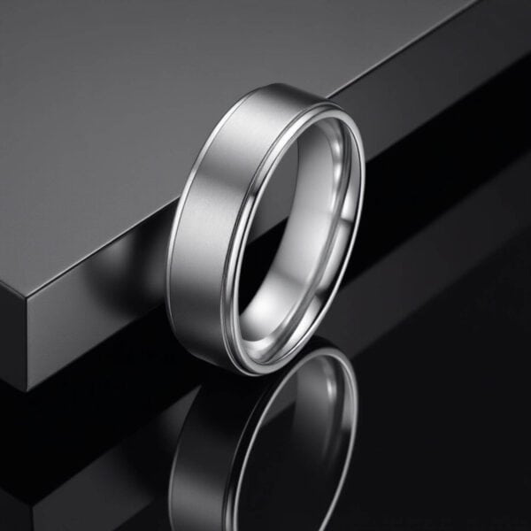 Silver titanium promise ring for him. With polished edges and featuring a raised centre which has a brushed finish