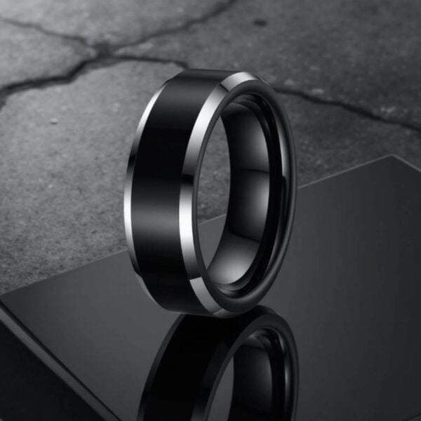 Mens black and silver titanium ring. The perfect gift to give to your man for a wedding, birthday, anniversary, or engagement.