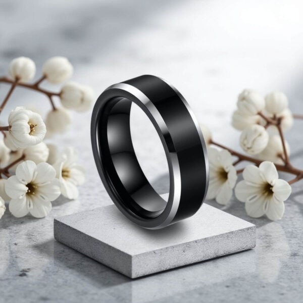 A distinctive mens ring perfect as a promise ring for guys, or as a standout mans eternity ring. Featuring a matte black centre section and bevelled edges that are a polished silver.