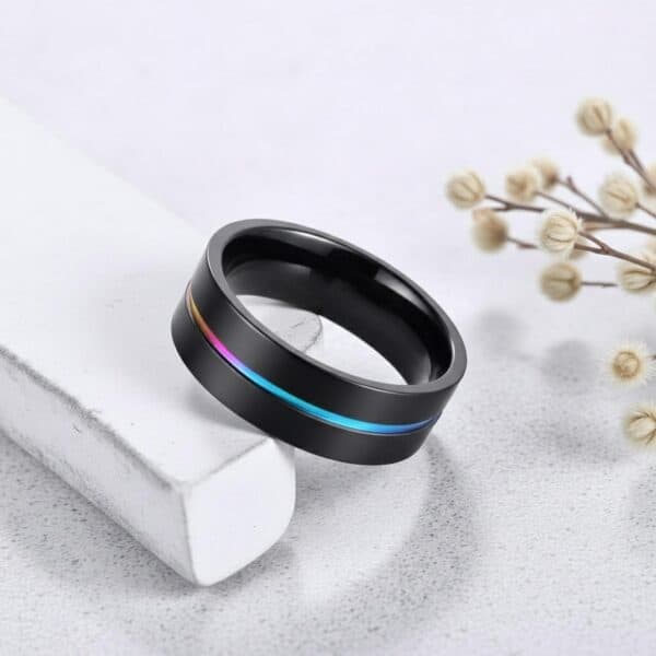 Mens iridescent black titanium ring – statement wedding band with personalised custom engraving.