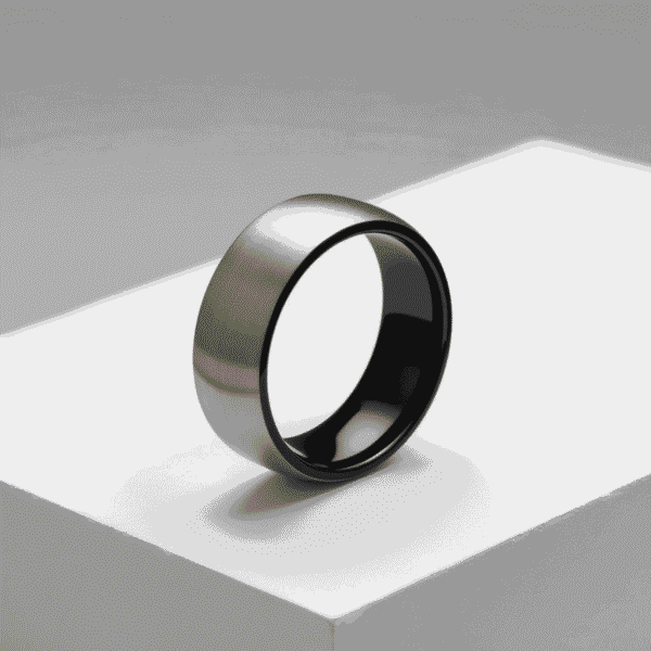 Mans engagement ring. A brushed silver titanium ring for gents featuring black rims and a black interior.