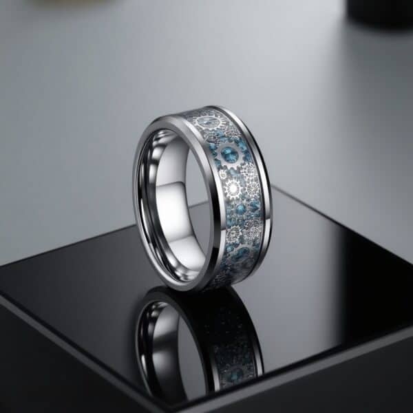 Cogwheel ring for men featuring blue carbon fibre with gear detailing set in a silver tungsten band.