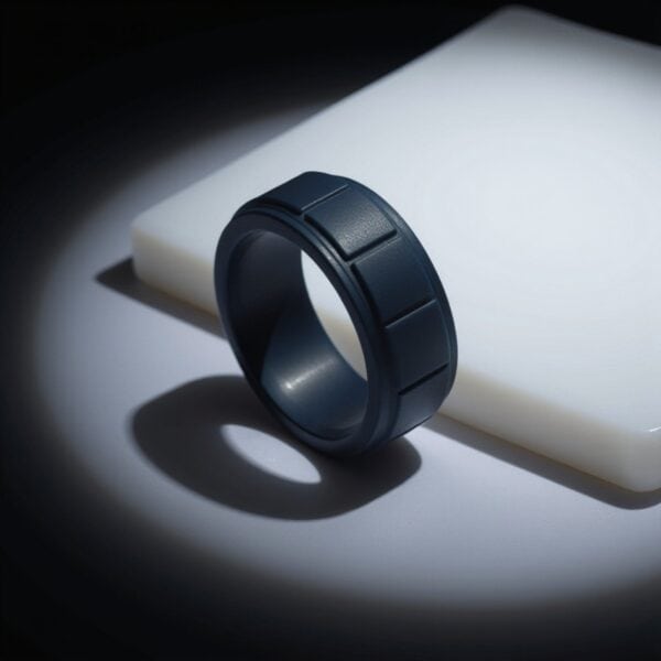 Lightweight navy blue flexible silicone ring for men with block pattern. A versatile male engagement ring, gents eternity ring, or mans stretchy sports band.