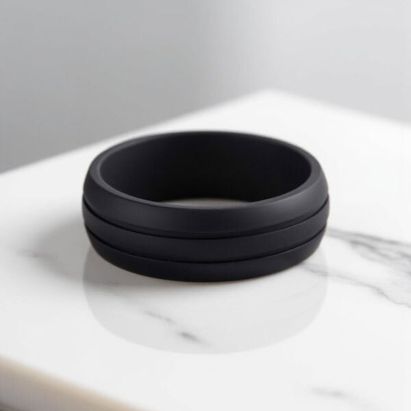 Stylish black silicone ring for men with double grooves. A mans wedding band, gents promise ring, or flexible stretchy ring for guys.
