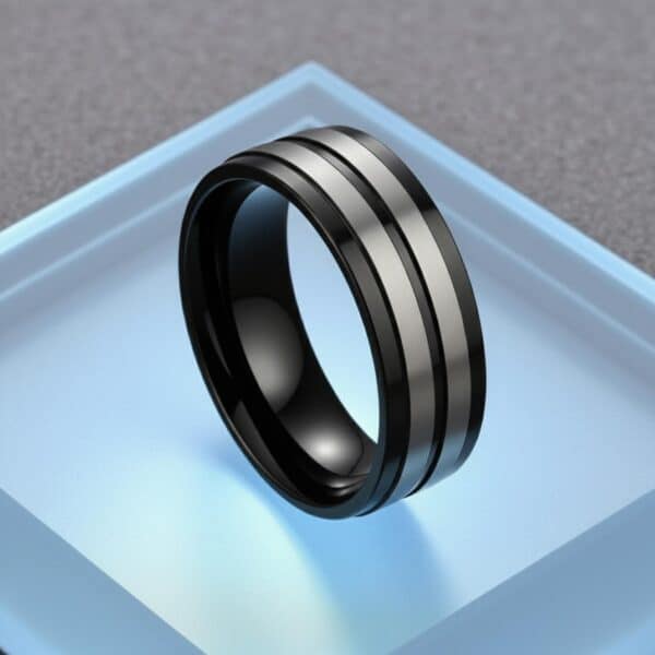 Men’s titanium ring in black and silver tones, suitable as a gents eternity ring for everyday wear.
