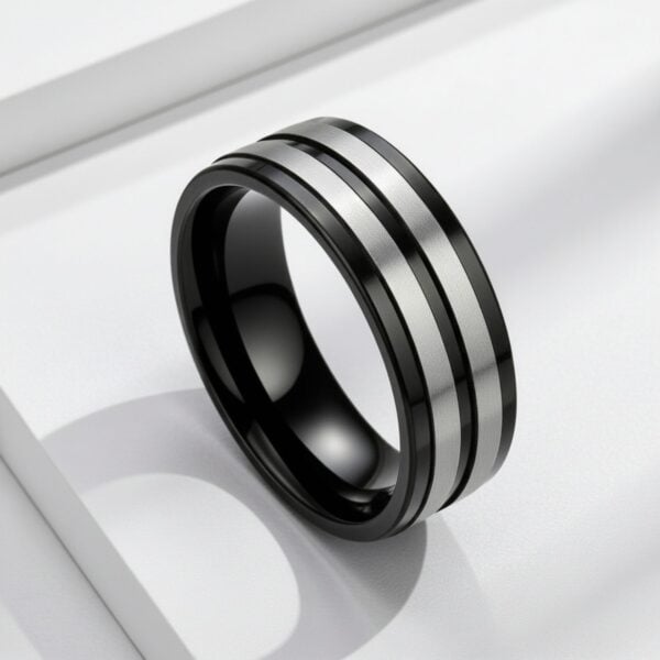 Black and silver men’s titanium wedding band with bold contrast and clean modern styling.