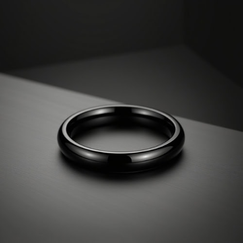A refined black band for men, crafted as a slim titanium ring with personalised ring engraving for weddings, milestones, or promises.