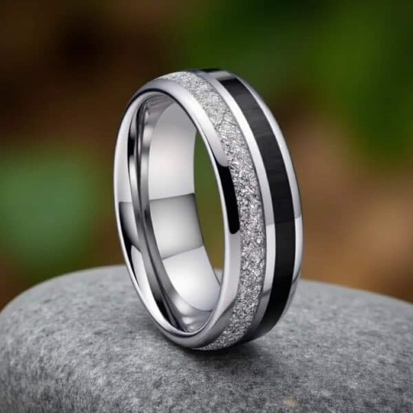 Unique male engagement ring in tungsten with faux meteorite and carbon fibre, a bold promise ring or fashion statement ring for guys.