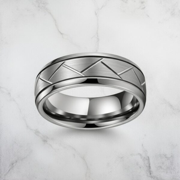 The Valiant silver tungsten men’s wedding band with brushed centre and polished grooves for him.