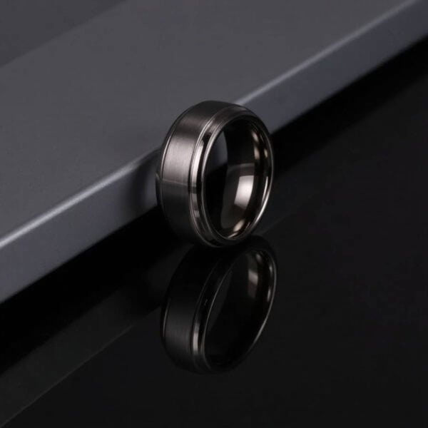 A promise ring for him. This tungsten ring is finished in gunmetal grey and will bring style and elegance to every outfit. Also suited as a male fashion statement ring.